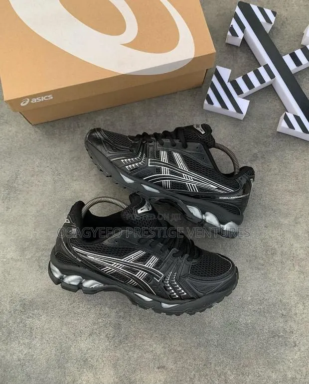 Asics Gel-Kayano 14 (Black/Silver Colorway). · Photo 1
