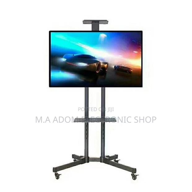 Modern Tv Stand on Wheels Rolling Tv Cart 32”-70” · Photo 1