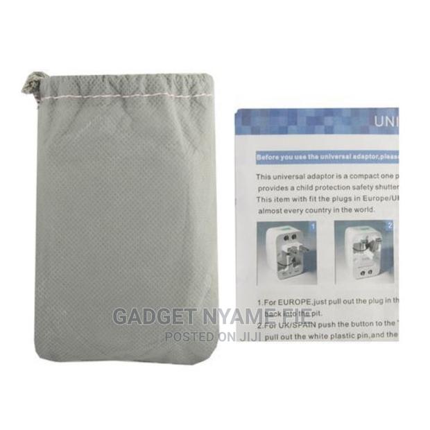Universal World Charger Adapter Plug All in One Travel Ac Po · Photo 1