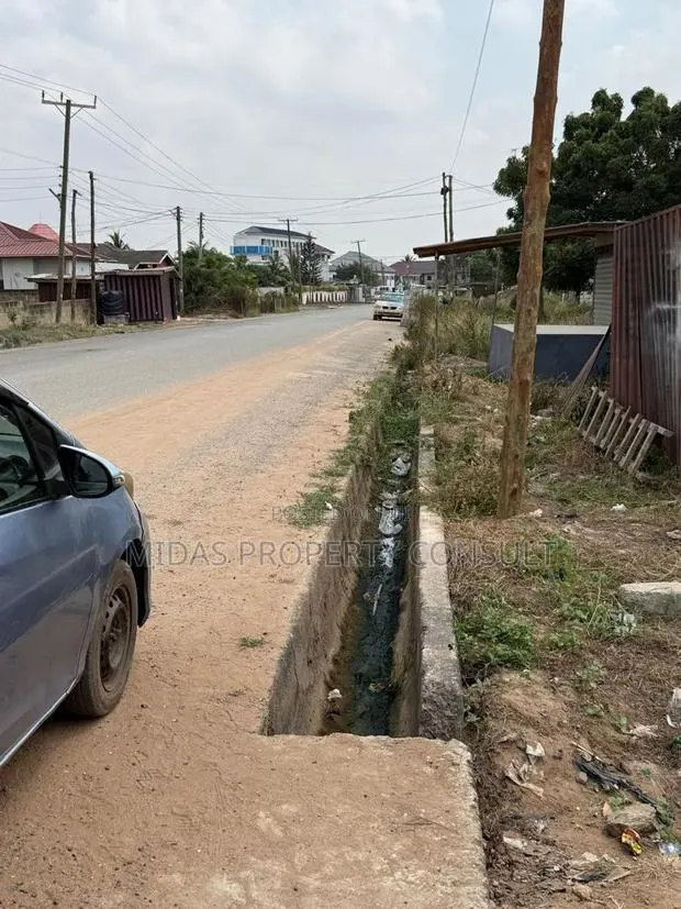 Roadside 100x100ft Land for Sale at Agbogba Academic City · Photo 1