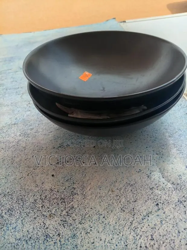 A Black Ceramic Shallow Bowl. · Photo 1