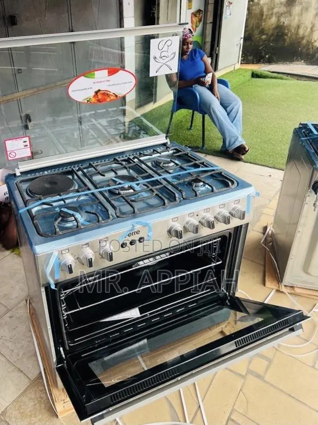Affordable Ferre 60x90cm Glass Lid 4 Gas + 1 Electric Cooker(Gray). · Photo 1