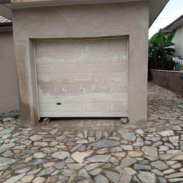 American Automatic Garage Door Now Available at Bluecity · Photo 8