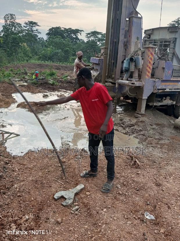 Borehole Drilling Services With Quality Pump and Blue Pipes · Photo 2