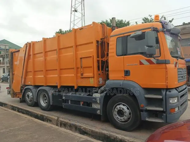 MAN Compactor 2007 Orange for Sale · Photo 1