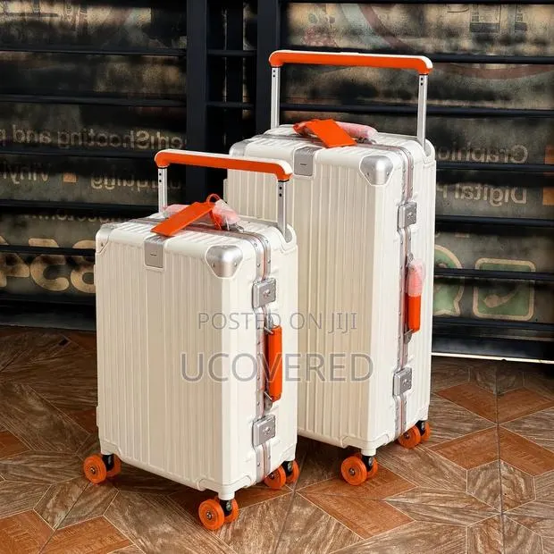 Hard-Shell Suitcases Feature a Wide-Handle Design · Photo 1