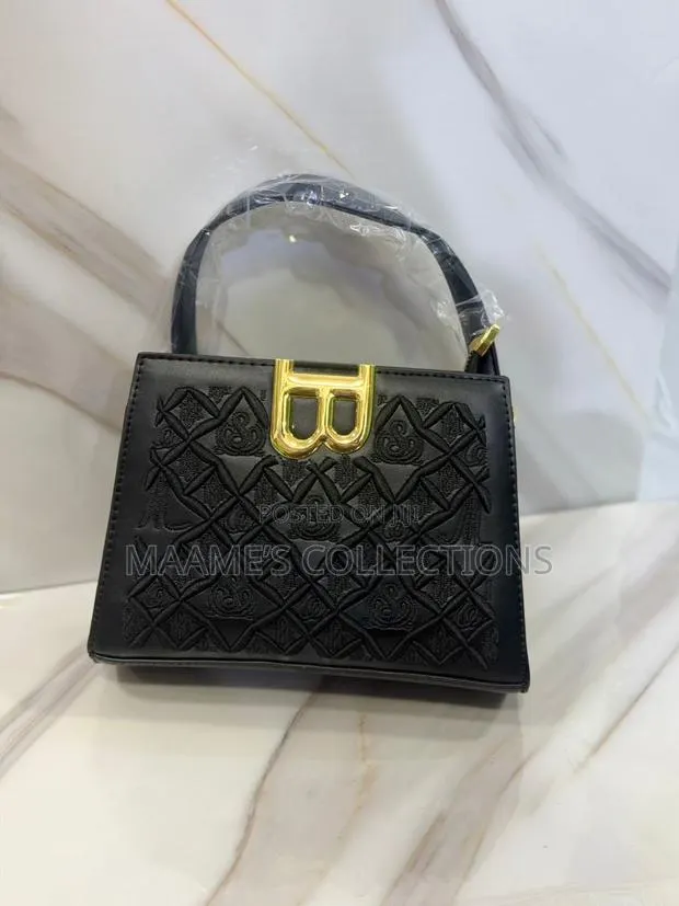 Luxury Embroidered Top Handle Handbag With Crossbody Strap · Photo 1