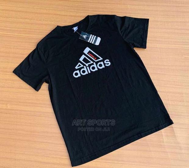 Adidas Tops · Photo 1