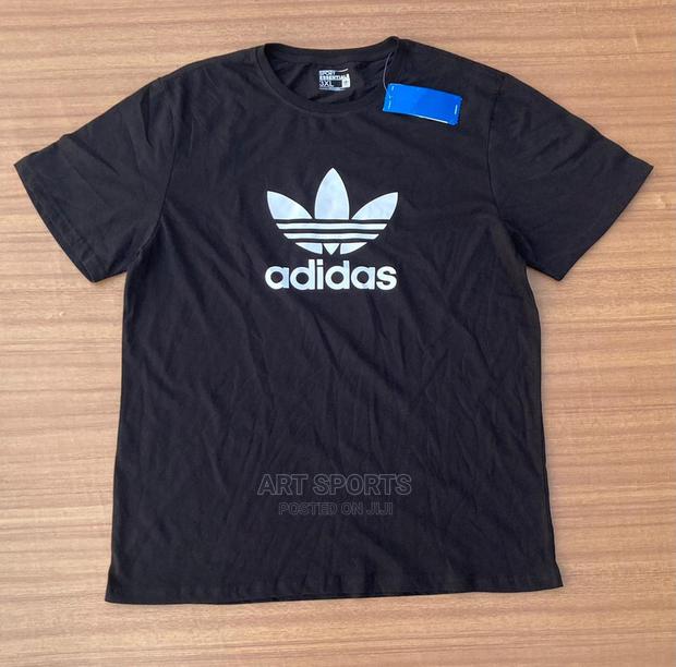 Adidas Tops · Photo 1