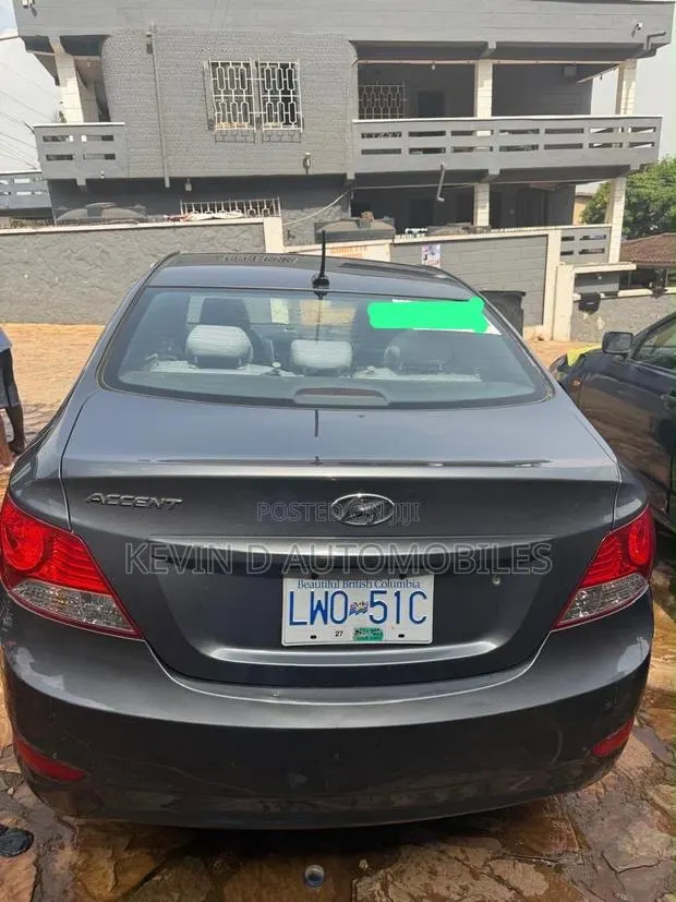 Hyundai Accent GLS 4dr Sedan (1.6L 4cyl 6M) 2014 Gray · Photo 1