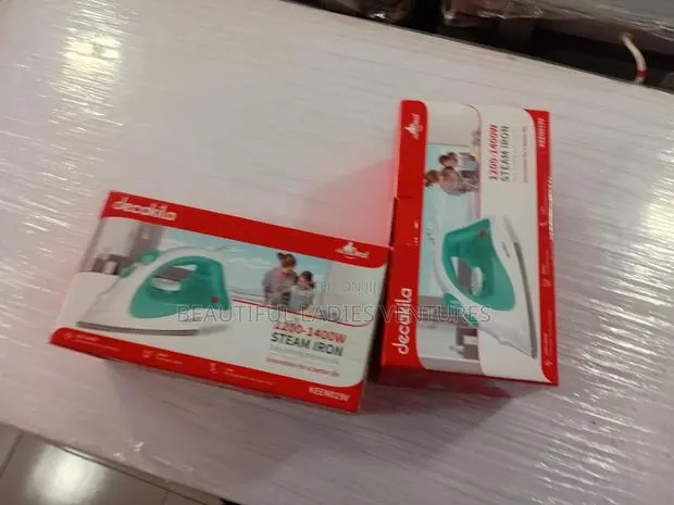 Fast Heating Steam Iron With Smooth Glide Technology · Photo 1