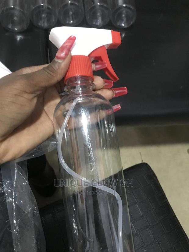 Spraying Rubbing Liquid Sanitizer Bottles With Sprayer · Photo 1