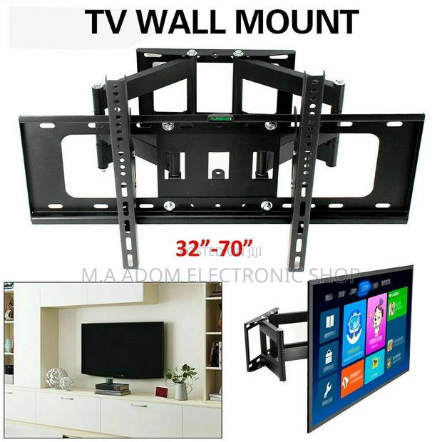 Tv Wall Mount for 32”-70” With Swivel Arm · Photo 1