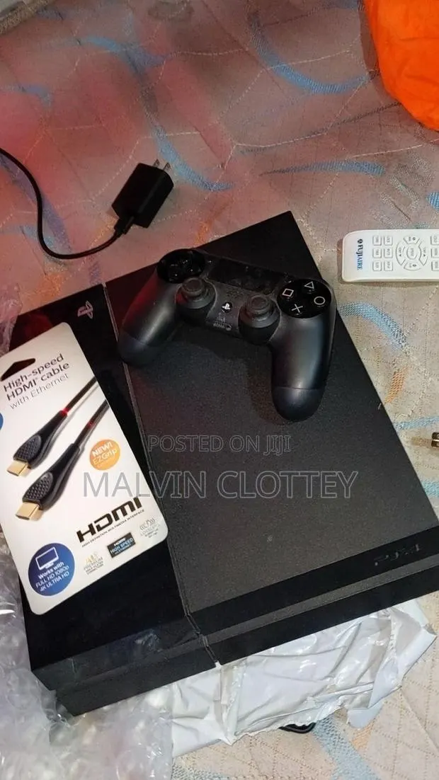Ps4 Slim With One Controller and Games · Photo 1