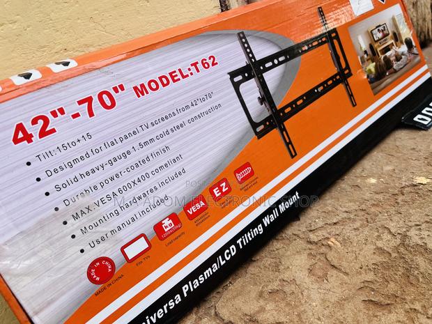 Fits Most Tv Screens Tilt 15 Degrees Mount 32”-70” · Photo 1