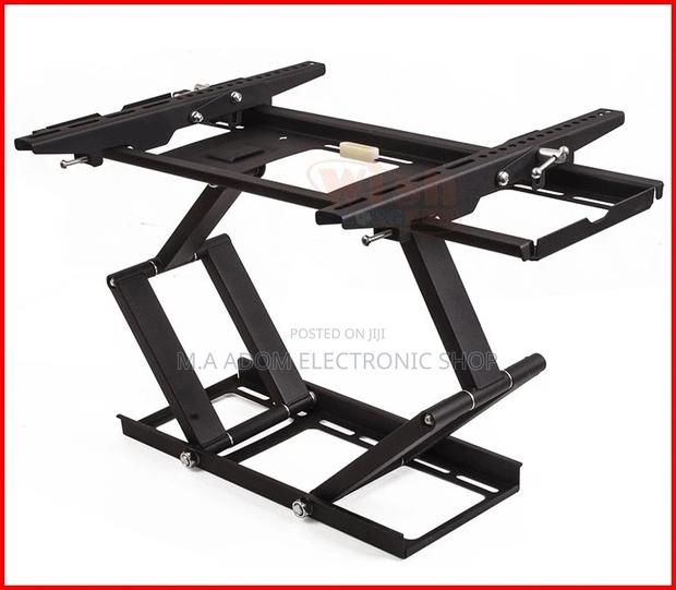 Save More Space With Full Motion Adjustable Tv Mount 32”-75” · Photo 1