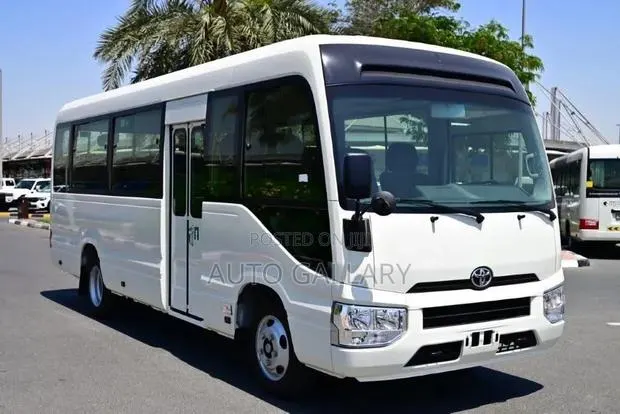 New Toyota Coaster 2025 White · Photo 1