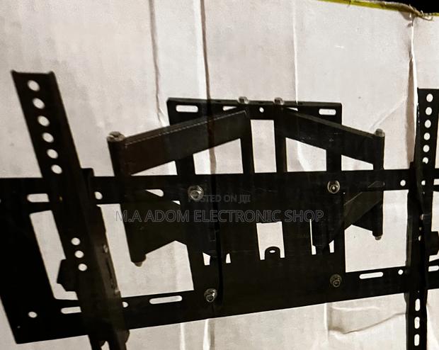 Very Easy Simple to Mount Flexible Wall Mount 32”-70” · Photo 1