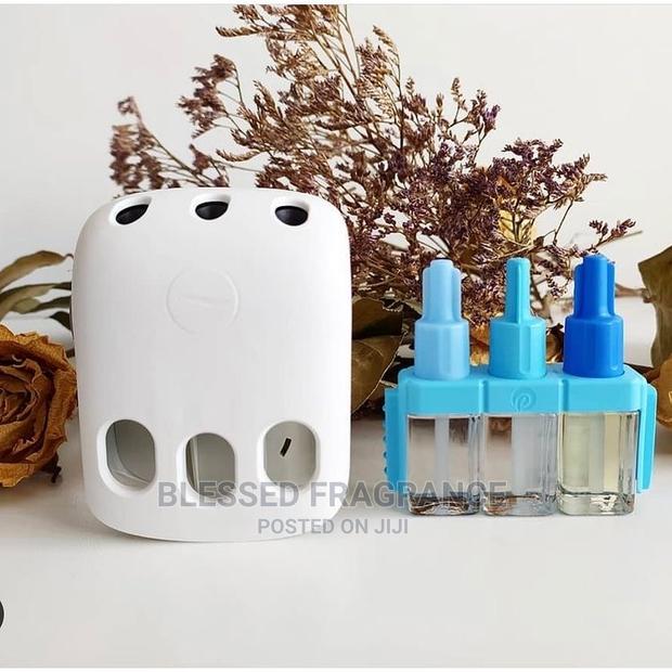 Febreze Three Volution Plugin Air Freshener · Photo 4