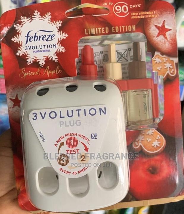 Febreze Three Volution Plugin Air Freshener · Photo 1