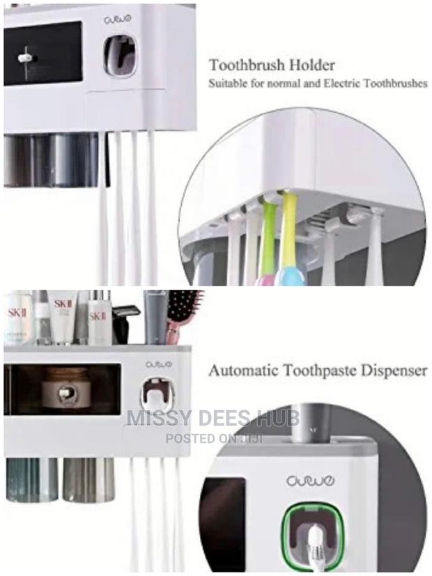Toothpaste Dispenser and Toothbrush Holder With 4 Cups · Photo 3