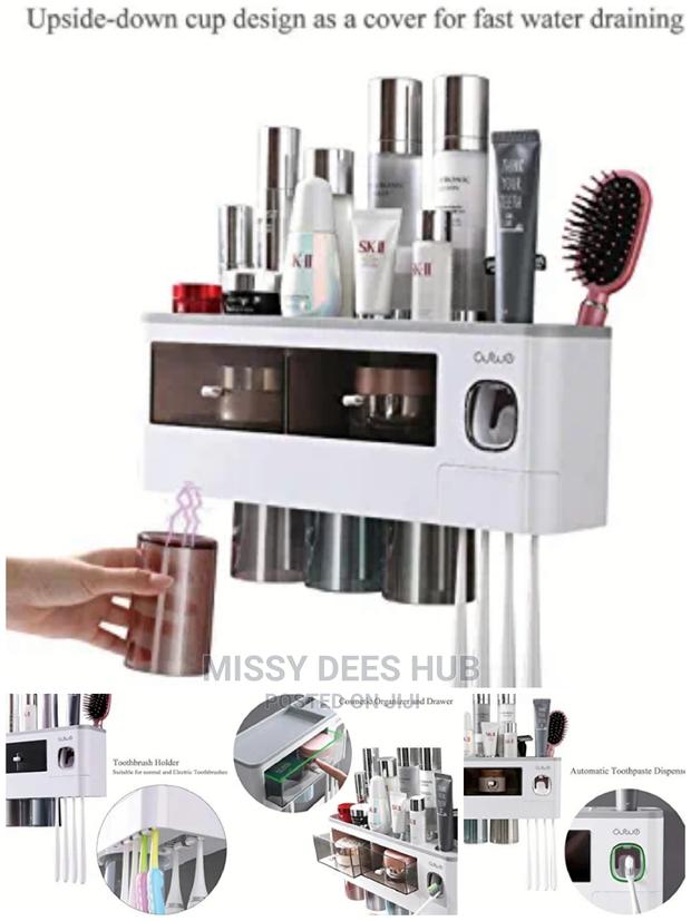 Toothpaste Dispenser and Toothbrush Holder With 4 Cups · Photo 4
