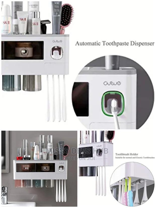 Toothpaste Dispenser and Toothbrush Holder With 4 Cups · Photo 5