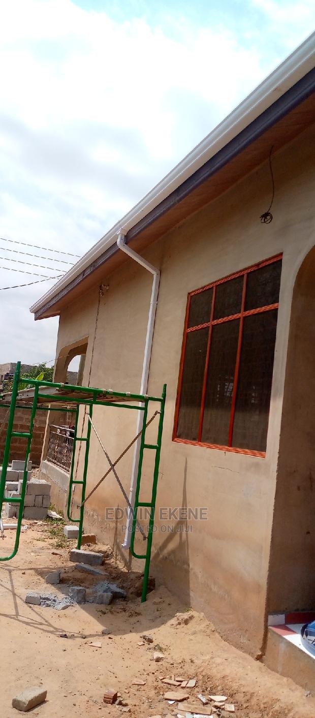 Roof Rain Gutter Pipe Installation · Photo 1