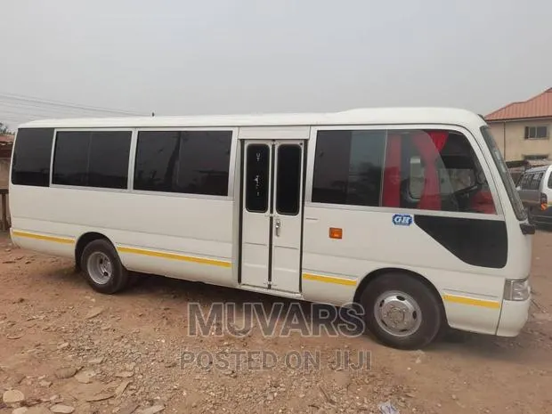 Car for Rent. Toyota Coaster 30 Seater for Rental in Accra. · Photo 1