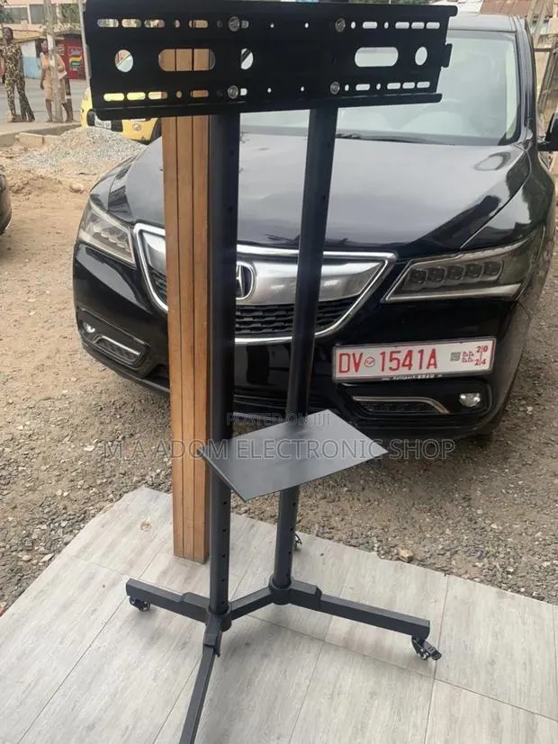 Reliable Moveable Tv Trolly for 32” to 70 Inch Television. · Photo 1