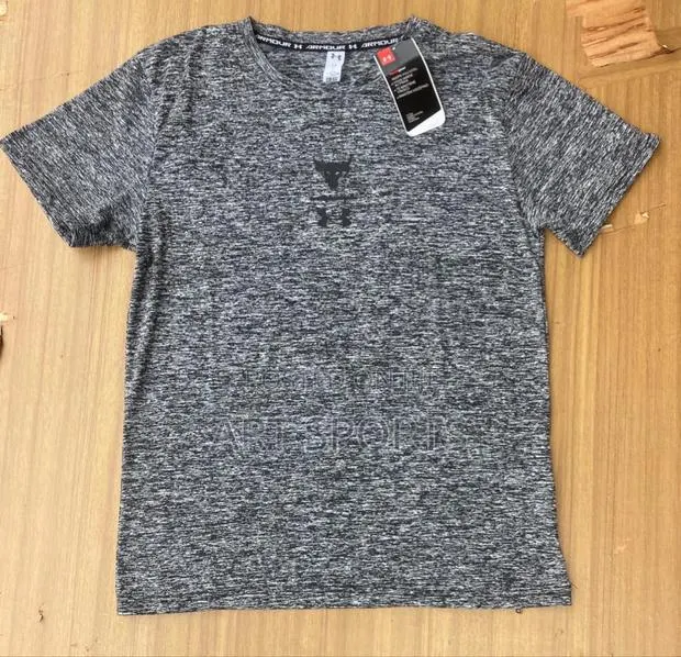 Under Amour Tops · Photo 1
