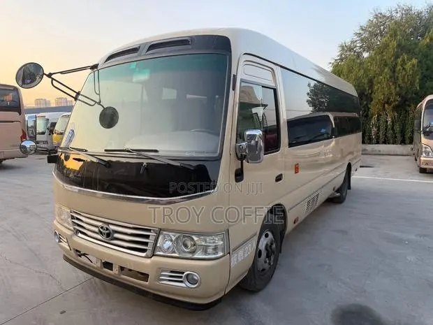 Toyota Coaster 2020 Beige · Photo 1