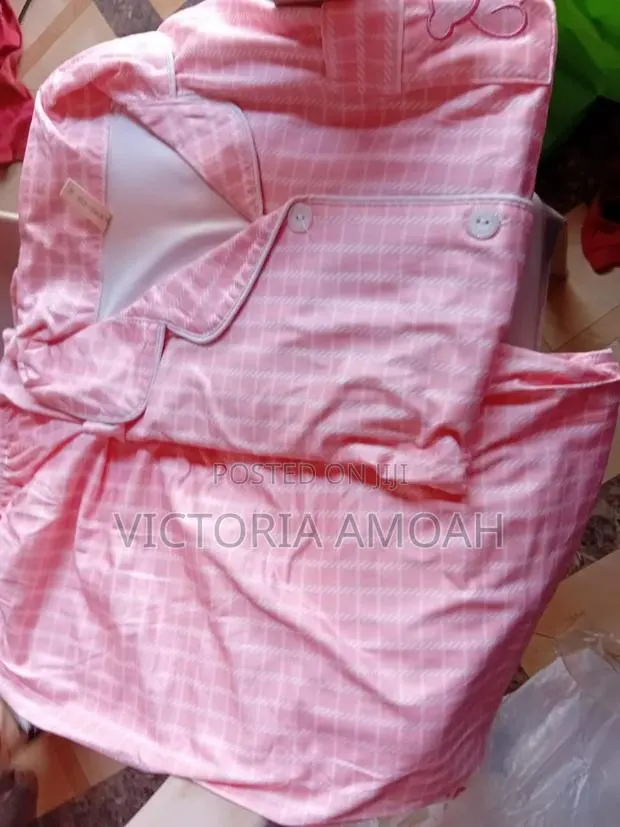 A Pink and White Striped Button-Down Pajama Set. · Photo 1
