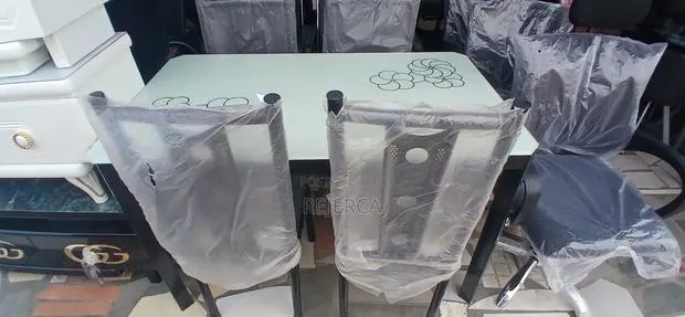 Durable Dinning Table With 4 Chairs · Photo 1