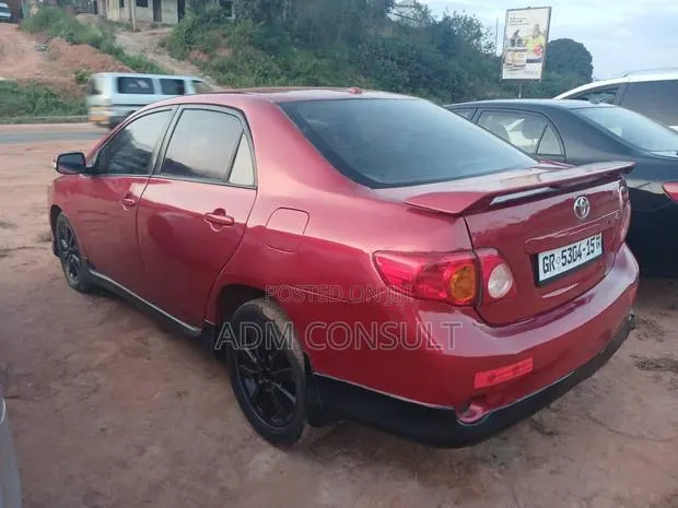 Toyota Corolla LE 4dr Sedan (1.8L 4cyl 4A) 2010 Red · Photo 1