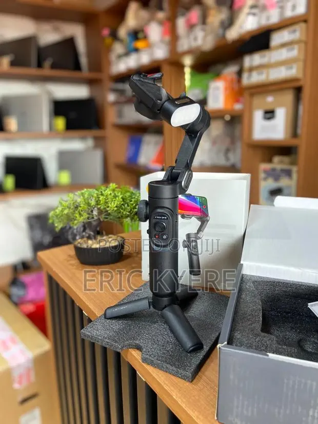 Smart 3-Axis Handheld Smartphone Gimbal Stabilizer With Light & Tripod · Photo 1