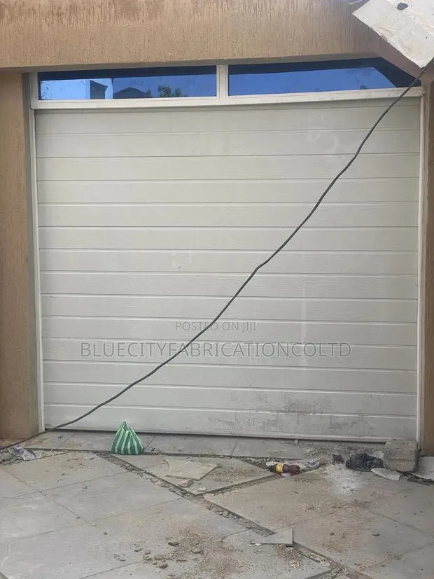 New American Automated Garage Door System 9ft X 8ft Fanlight Extended · Photo 1