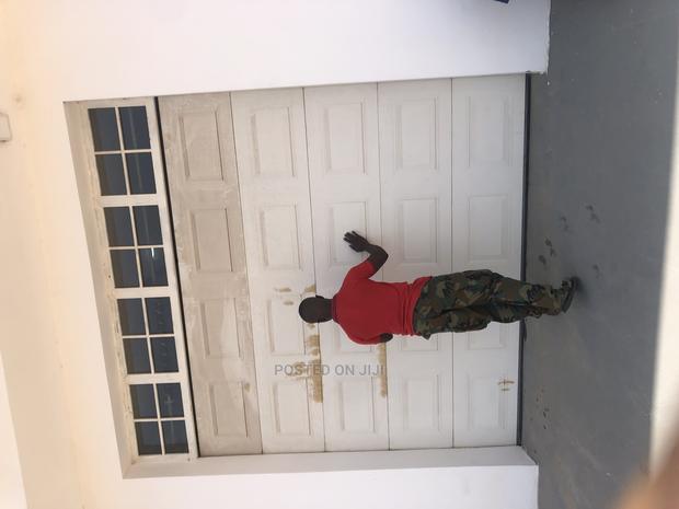Mordern Automatic Garage Doors · Photo 1