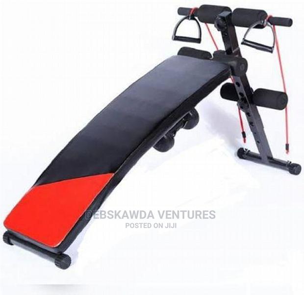 Stomach Bench With Dumbbells · Photo 1
