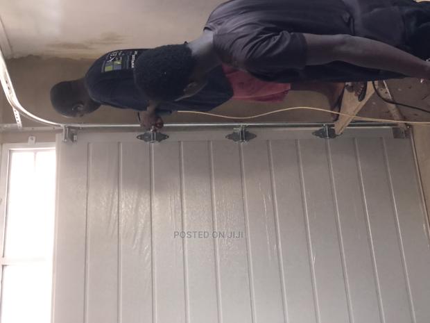 Ultra Automated Mordern Garage Door · Photo 3
