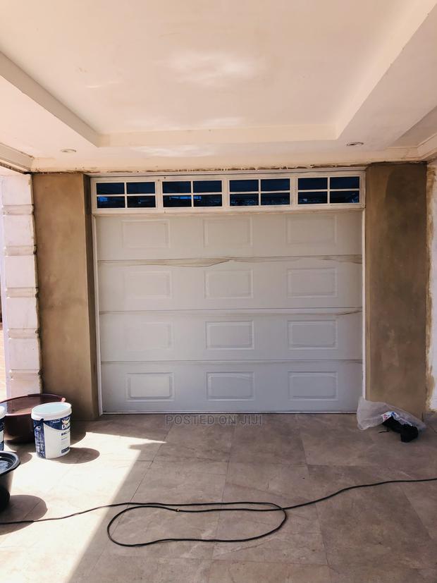 Ultra Automated Mordern Garage Door · Photo 1