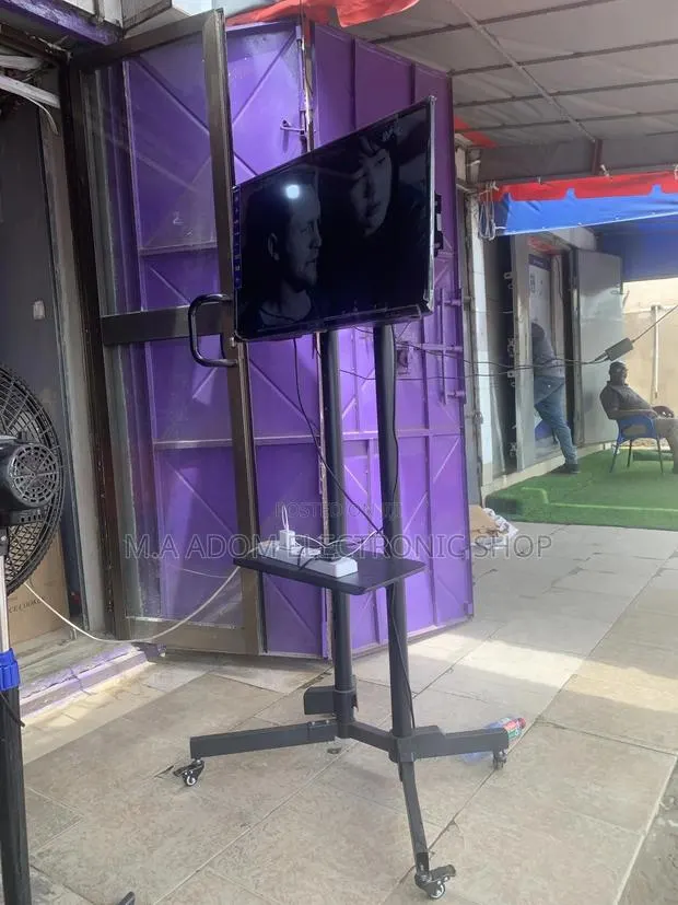 Movable Tv Stand Trolley With Wheels 32”-70” · Photo 1