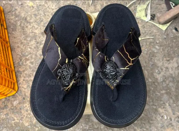 All Black and Gold Strip Ahenema Slippers · Photo 1