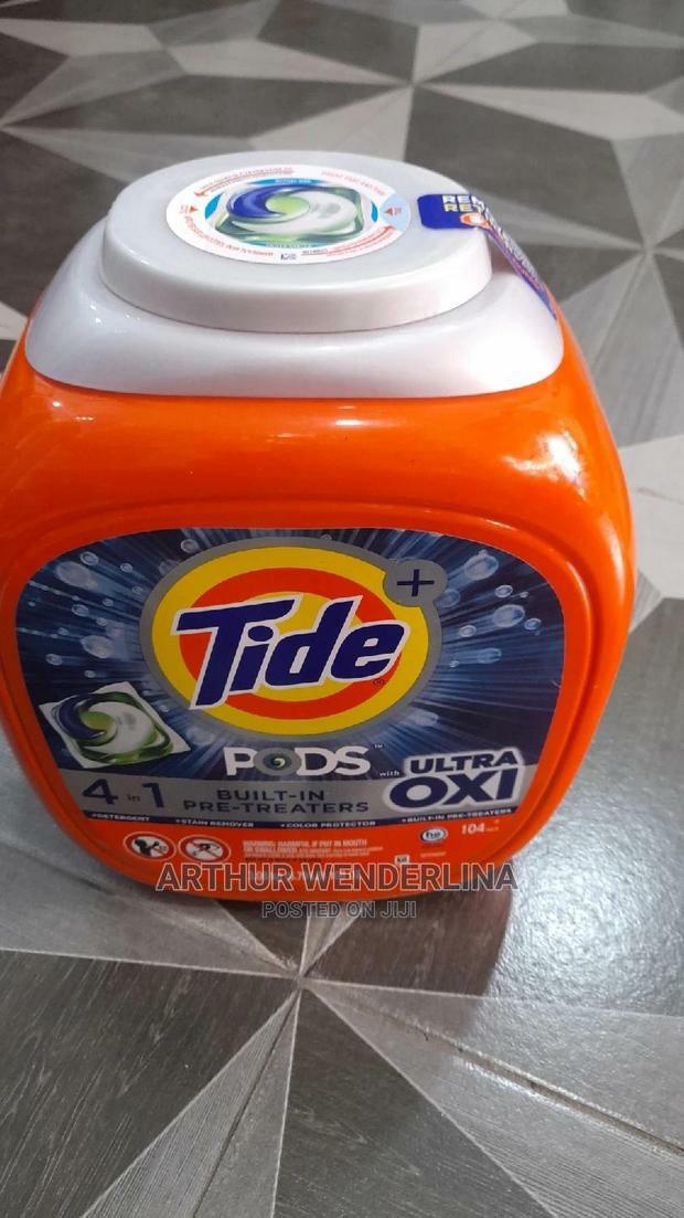 Tide Pods Ultra Oxi Laundry Detergent Fight Tough Stain · Photo 1