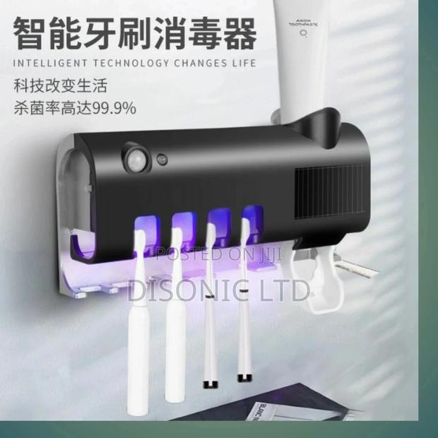 Solar Electric Sterilizing Brush Toothpaste Dispenzer · Photo 1