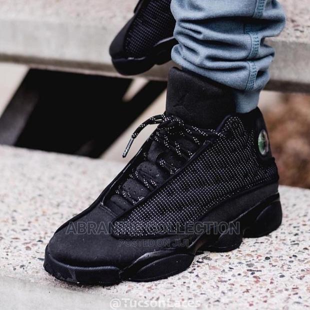 Air Jordan Retro 13 Black Cat · Photo 1