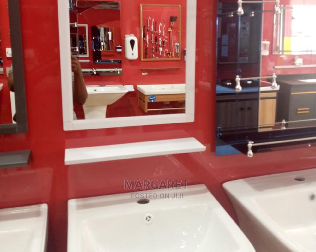 Mirror and Wash Hand Basin · Photo 1