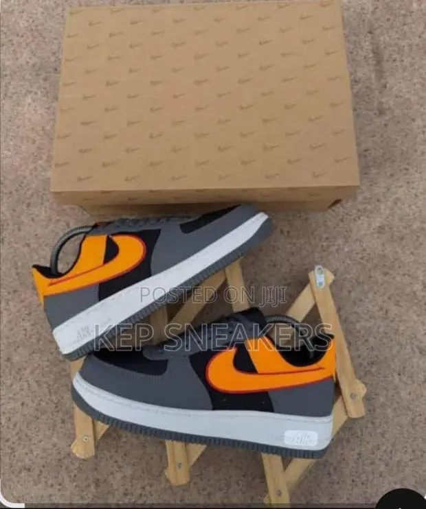 Nike Air Force 1 Low “Orange Swoosh” · Photo 1