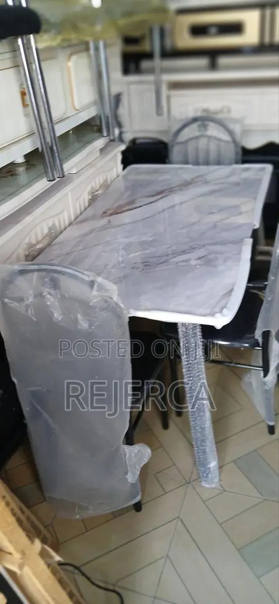 Durable Dinning Table With 4 Chairs · Photo 1
