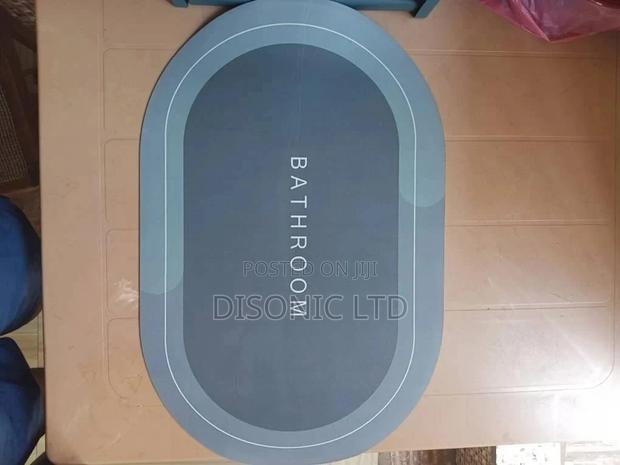 Water Absolvent and Antislip Bathroom Door Mats · Photo 1